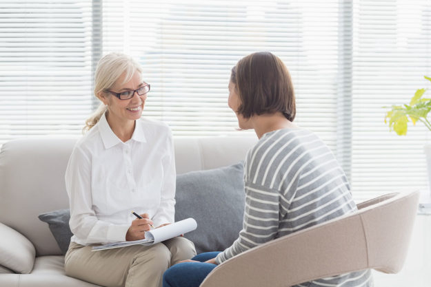 counselor talking to patient entering MAT