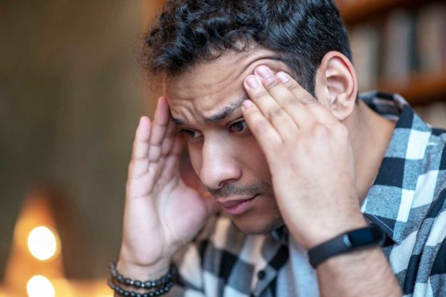 a man is stressed about the impact of mental health in the hispanic community