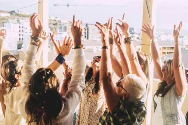 a group is happy to be a part of sober holidays