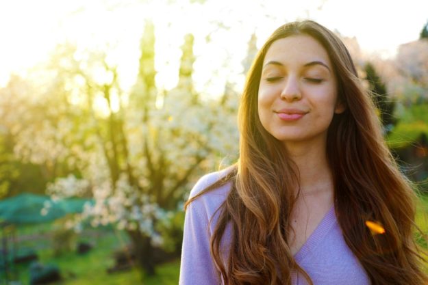 Holistic Mental Health Treatment Methods a woman smiles and benefits from holistic treatment