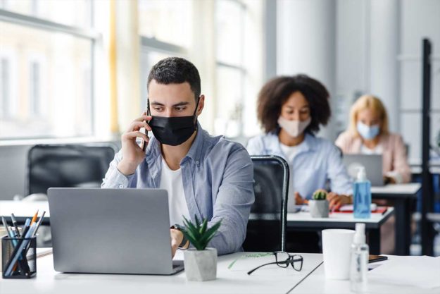 Stress-Free-Tips-for-Returning-to-the-Office-Post-COVID-19 a man returns to work despite some COVID-19 stress